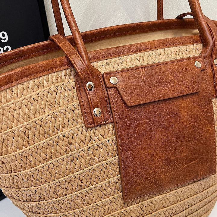 Miraee Paris Céleste boho tote bag featuring woven straw texture with brown faux leather trim and front pocket