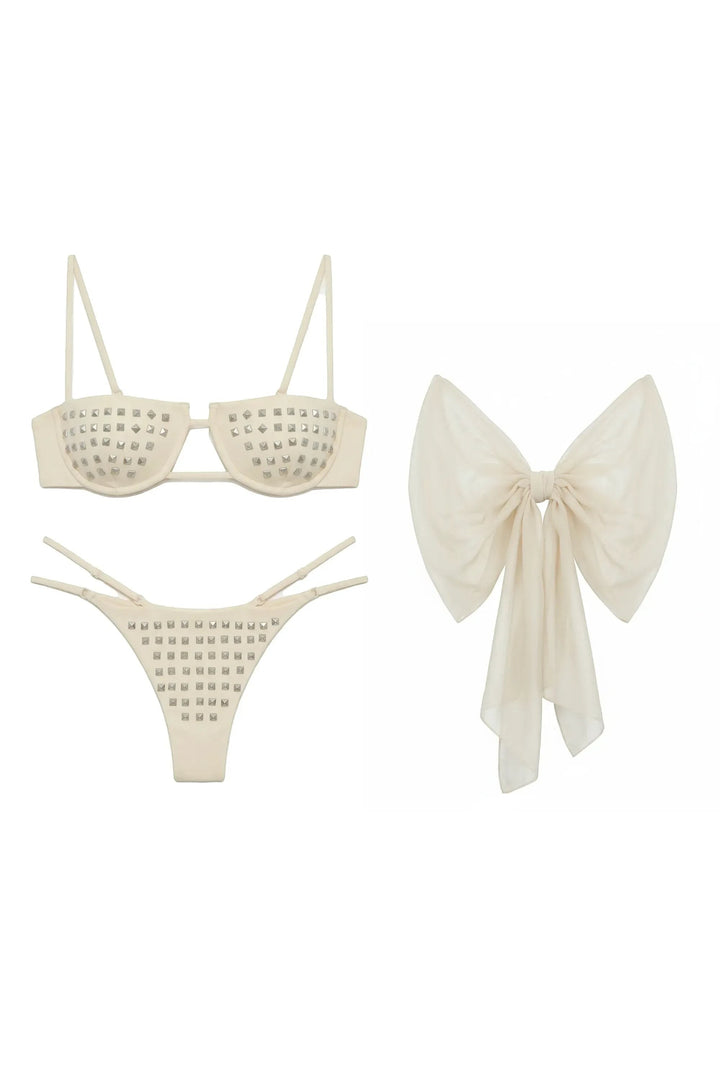 Miraee Paris Emma Rivet bikini set in cream with silver stud embellishments and a matching sheer bow accessory.