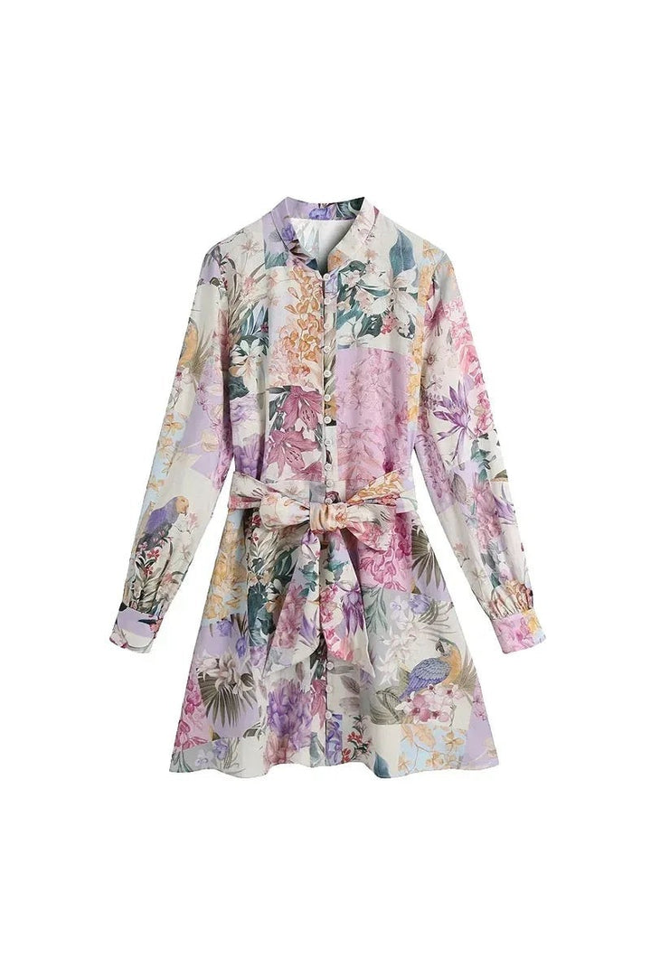 Miraee Paris Lena floral mini dress with long sleeves, button front, and a matching waist tie in pastel botanical print.