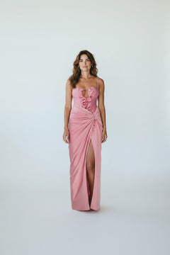 Miraee Paris Lara pink one-piece swimsuit with ruffled neckline and matching floor-length wrap cover-up skirt.