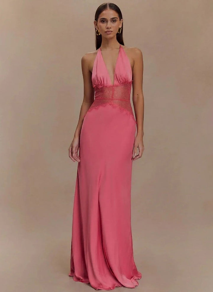 Miraee Paris pink halter neck maxi dress with lace patchwork waist detail and deep V-neckline on a model