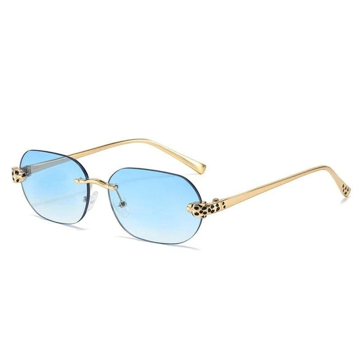 Miraee Paris Noir Panther rimless sunglasses with blue gradient lenses, gold metal frames, and cheetah detail hinges.