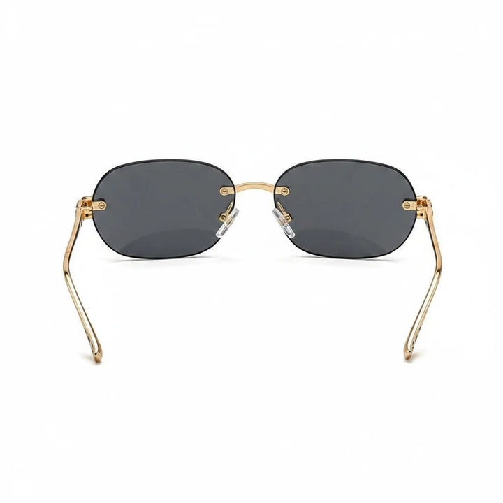 Miraee Paris Noir Panther rimless sunglasses with gold metal frames and dark grey UV400 lenses, rear view.