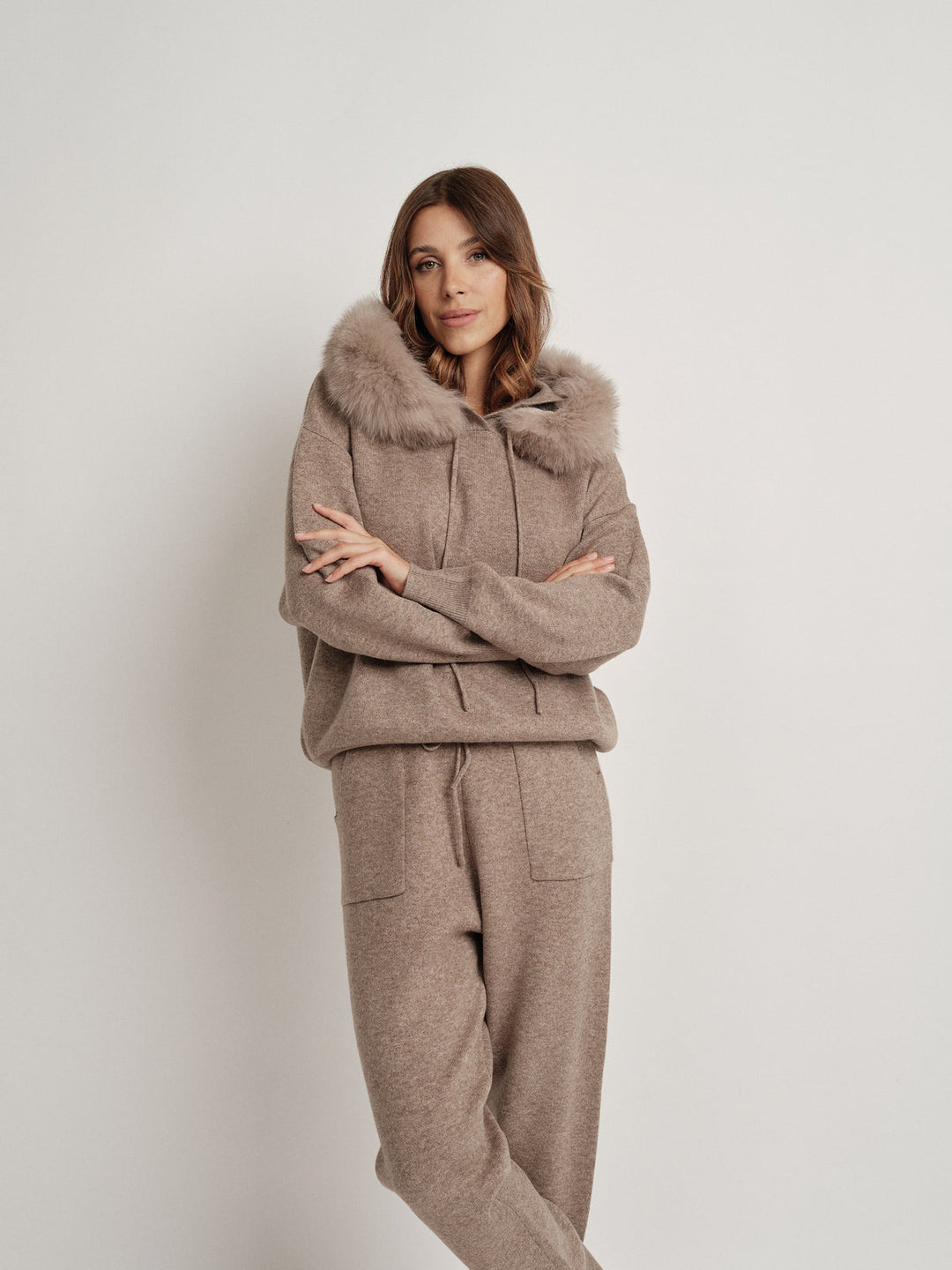 Bella Cashmere Lounge Set in elegant beige, featuring soft fur-lined hoodie and matching jogger pants, perfect for casual chic.