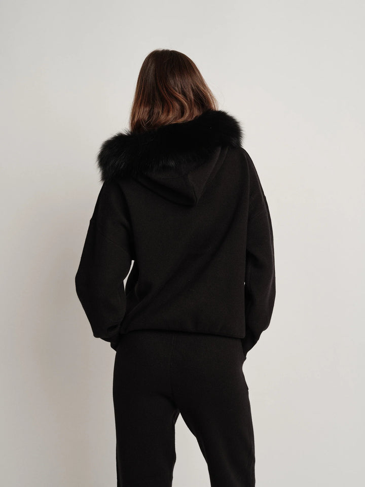 Bella Cashmere Lounge Set in black, featuring a luxurious fur-lined hoodie for stylish comfort.