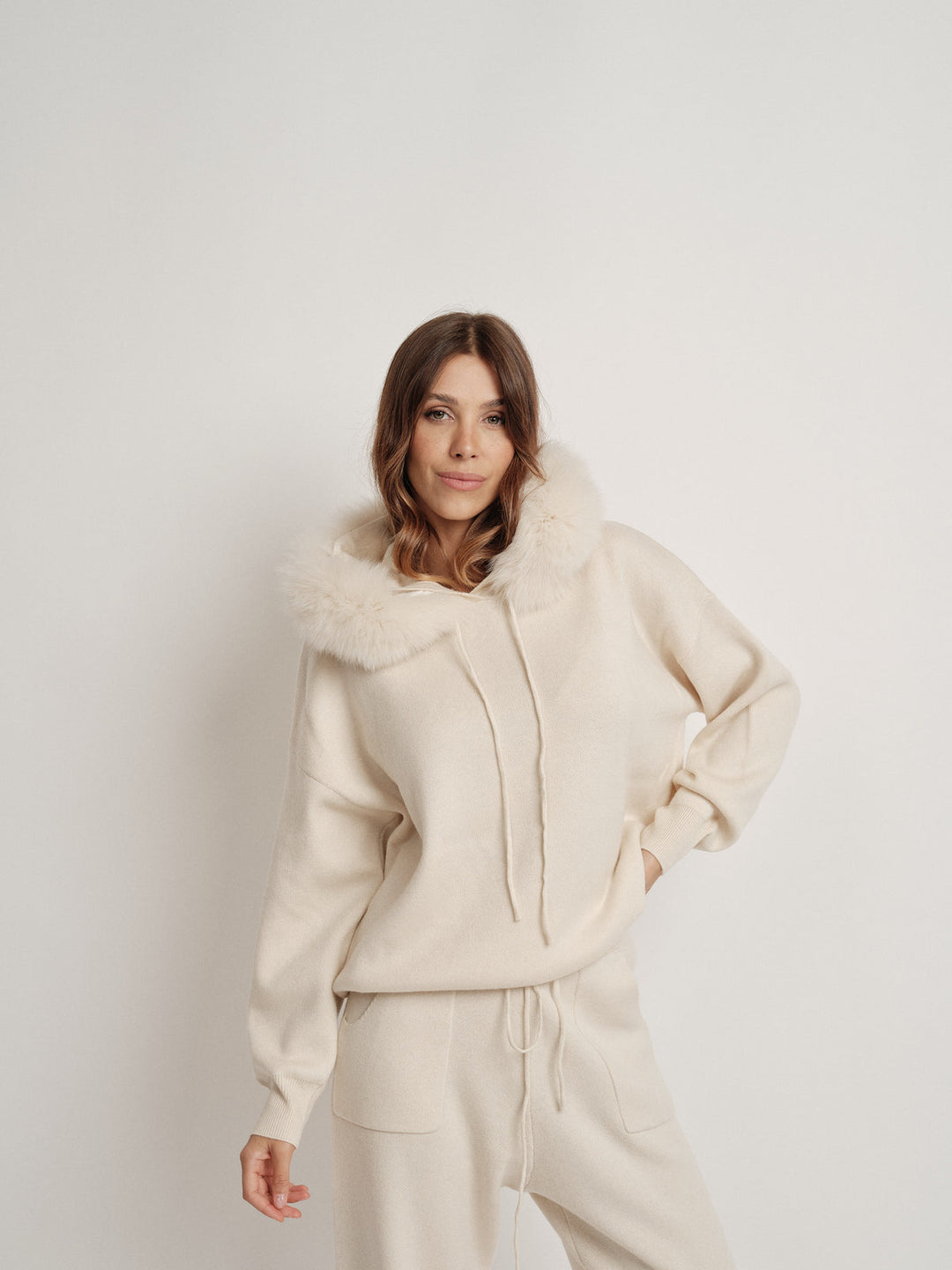 Bella Cashmere Lounge Set in beige with fur-lined hoodie for stylish comfort and elegance.