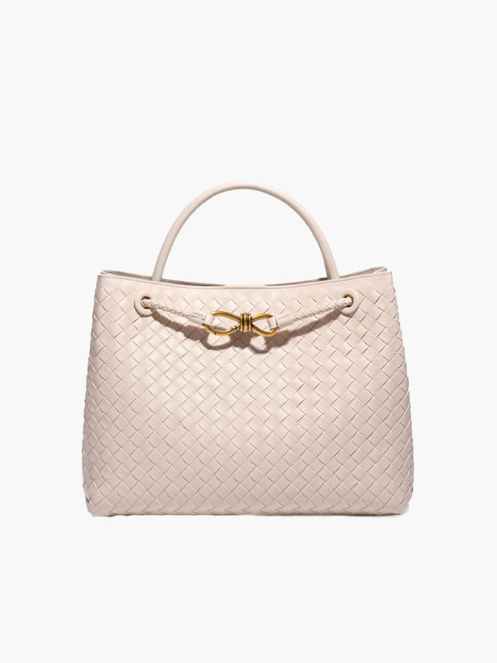 CELIA LARGE – Luxus Ledertasche in sanftem Beige mit elegantem Geflecht und goldenen Details.