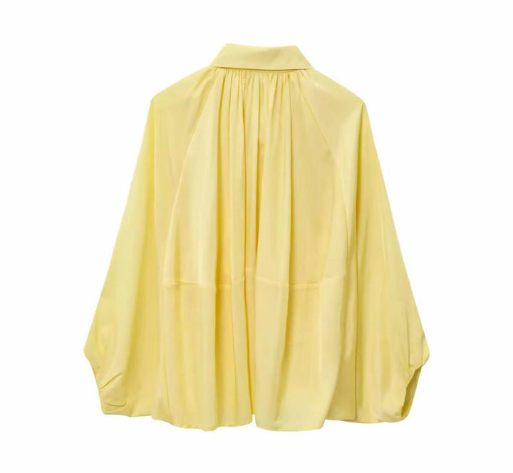 Miraéeparis Oversize Plissee-Bluse mit Ballonärmeln.