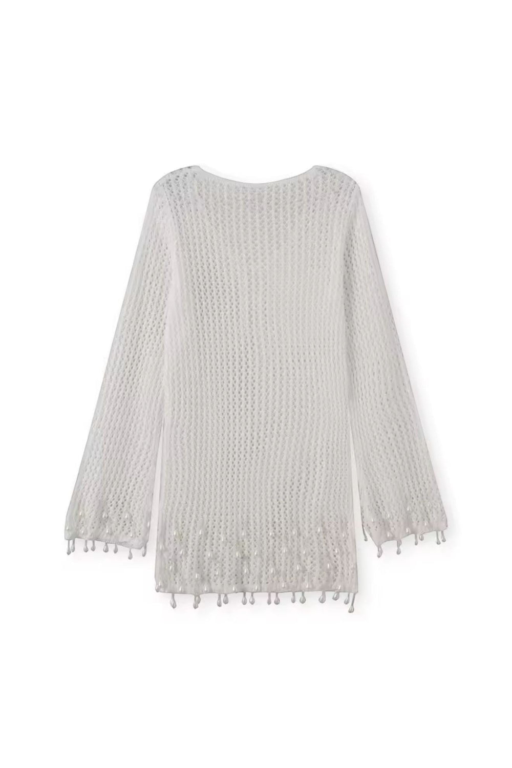 Miraee Paris white crochet beach cover-up with long sleeves and delicate tassel hem details in a breezy boho style.