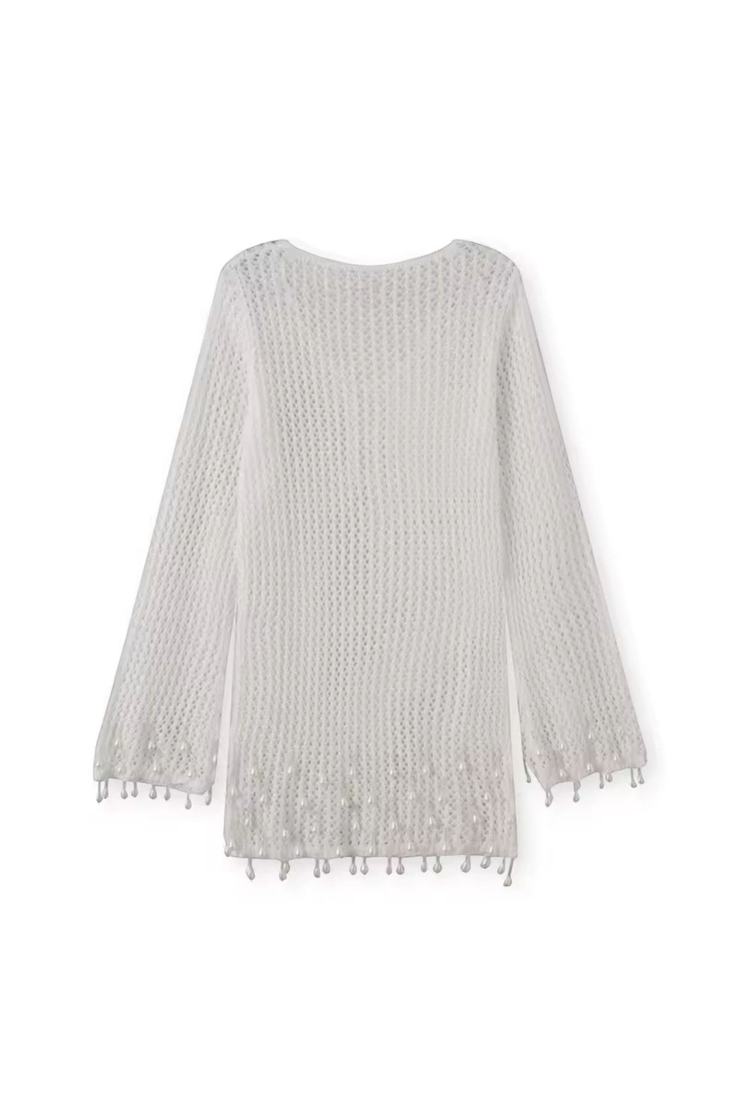 Miraee Paris white crochet beach cover-up with long sleeves and delicate tassel hem details in a breezy boho style.