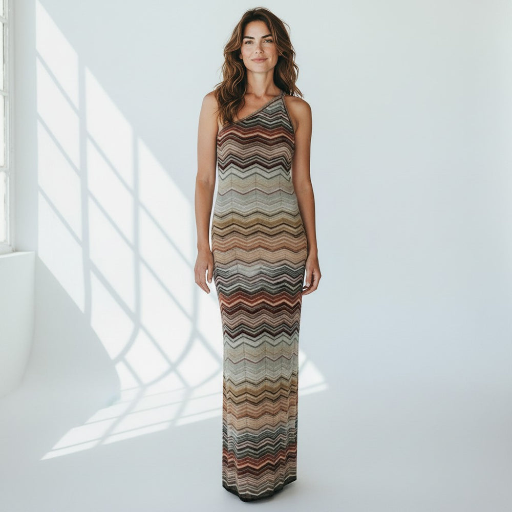 Miraee Paris one-shoulder maxi dress in a teal green and earth-tone zigzag knit pattern with a slim bodycon fit.